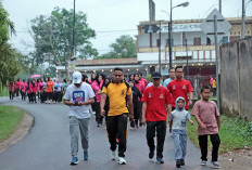 Sambut HUT Bhayangkara ke-79, Polres OKI Gelar Fun Walk dan Ziarah Makam Pahlawan